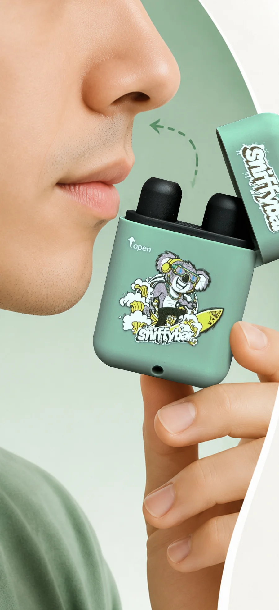 A person holding an open Sniffybar near their nose, with the lid flipped back and both nozzles showing
